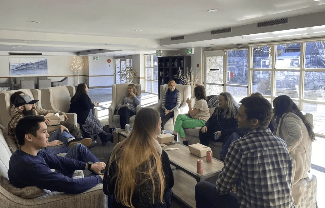 Avesta team gathered in a lounge for a team meeting